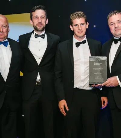 Derek Casserly (Henry J Lyons), Graham O'Sullivan (Henry J Lyons), Owen O'Gorman (Crown Roofing Ltd) and David Lee (Director, Collen Construction) collecting the award for Commercial Project of the Year - Block H, Central Park. 